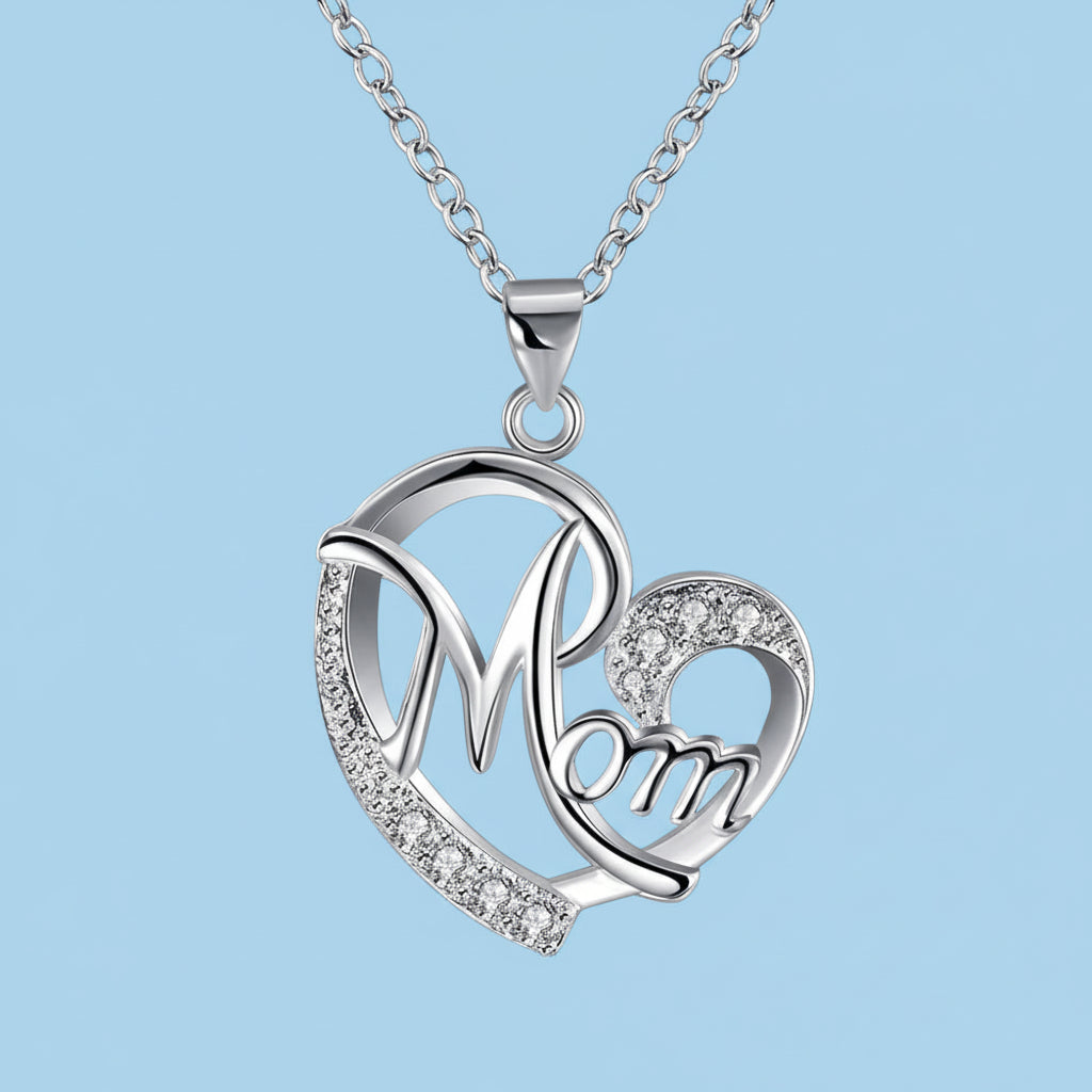 Silver 'Mom' heart pendant necklace on a light blue background