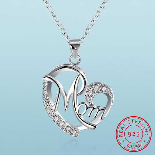 Silver 'Mom' heart pendant necklace with 925 sterling silver stamp on a light blue background