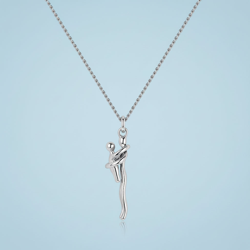 Silver necklace with a unique pendant on a light blue background