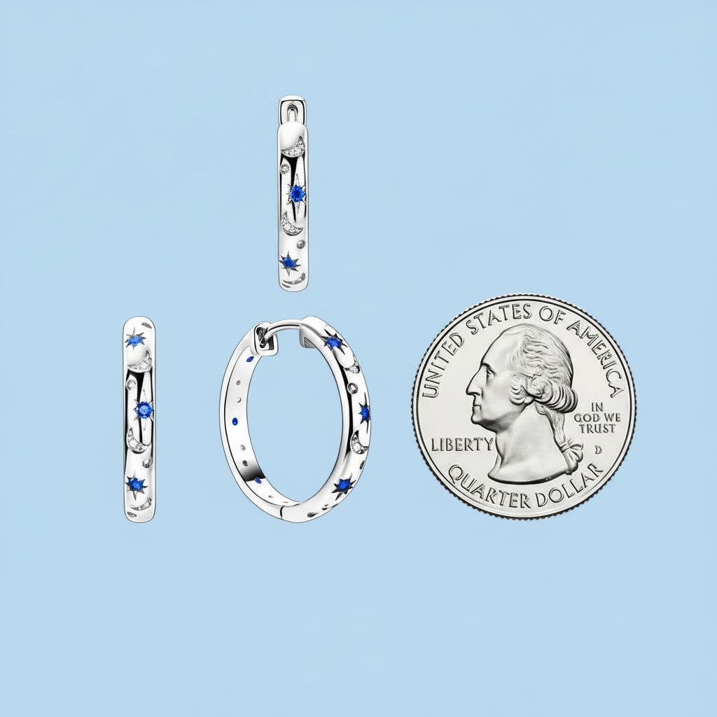 Hoop earrings with blue stones and their dimensions shown next to a quarter for scale.