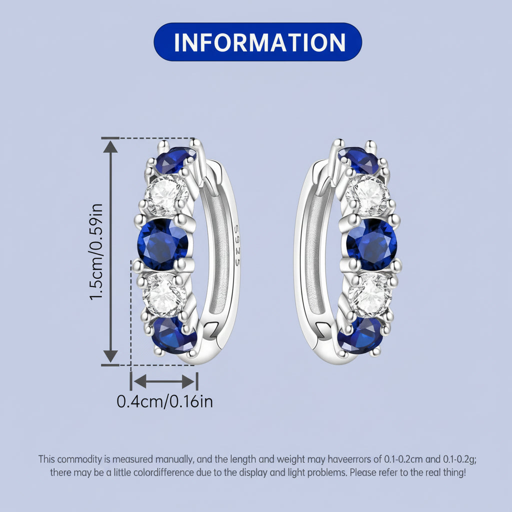 Silver hoop earrings with blue gemstones and clear stones, shown with measurements on a light blue background.