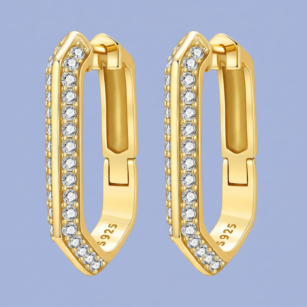 Gold hoop earrings with diamond accents on a white background