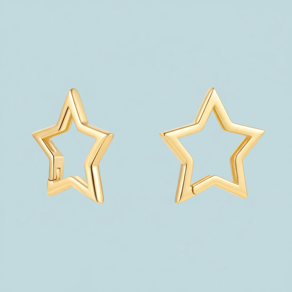 Gold star-shaped earrings on a white background
