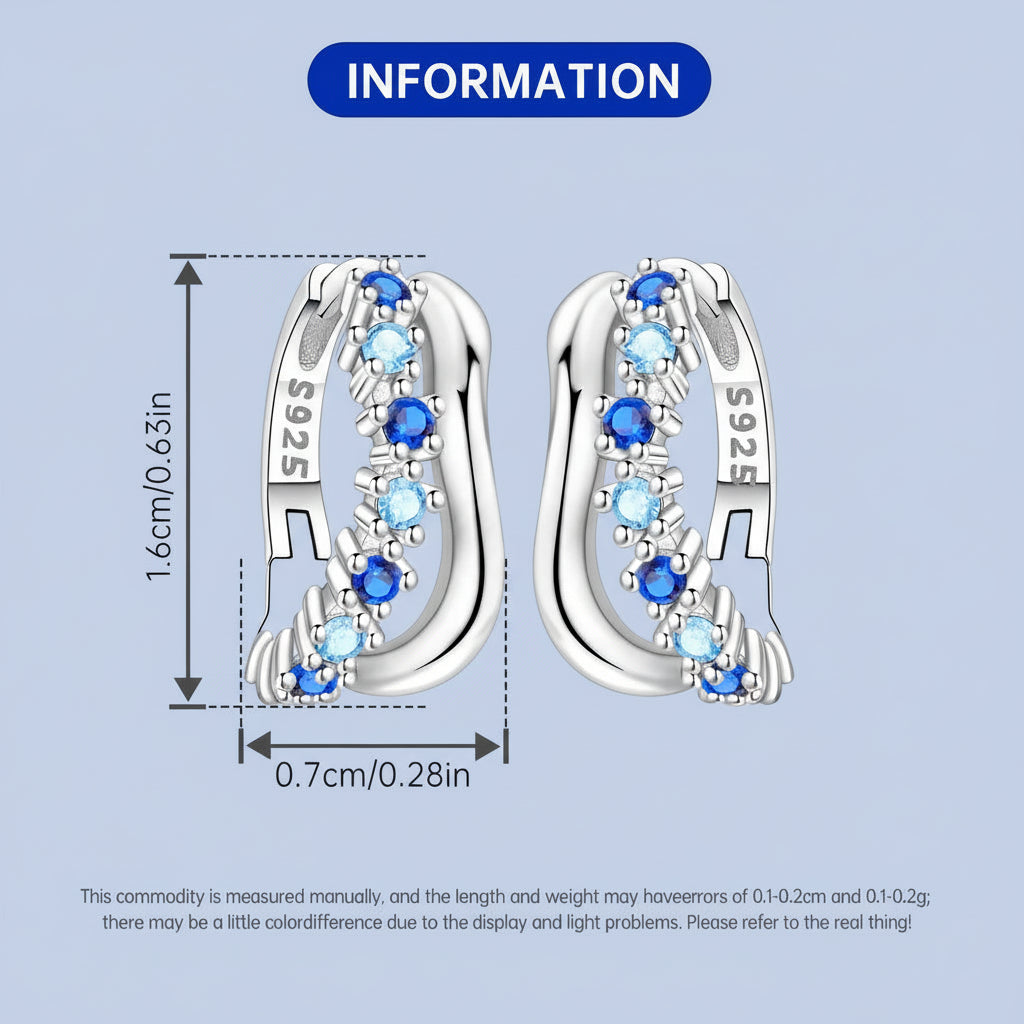 Silver hoop earrings with blue gemstones and measurements on a light blue background