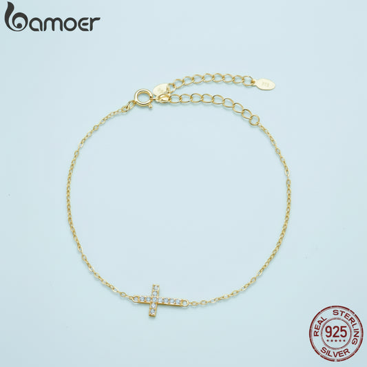 Gold bracelet with a cross charm and 'Bamoer' branding on a blue background.