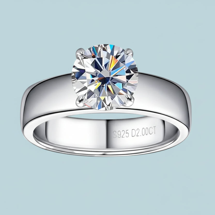 Silver ring with a large diamond on a white background