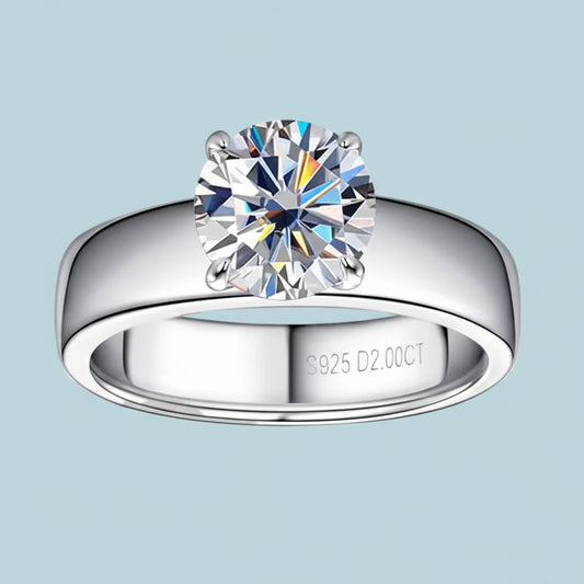 Silver ring with a large diamond on a white background