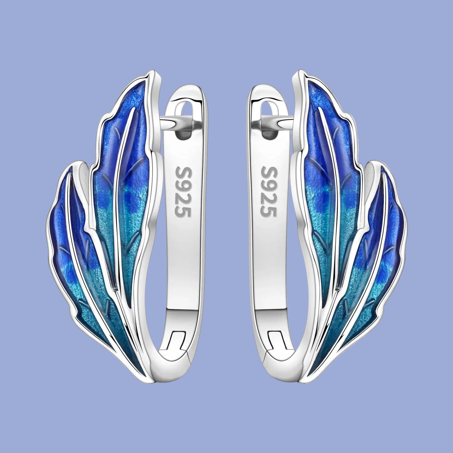 Silver earrings with blue feather design on a white background