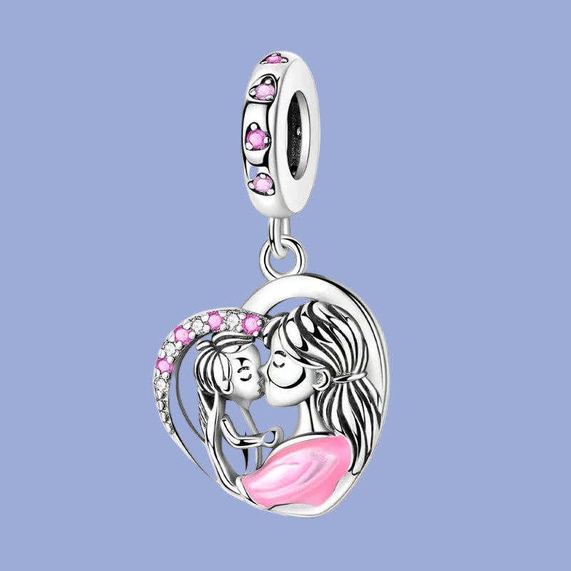 Heart-shaped charm with a mother and child design on a blue background