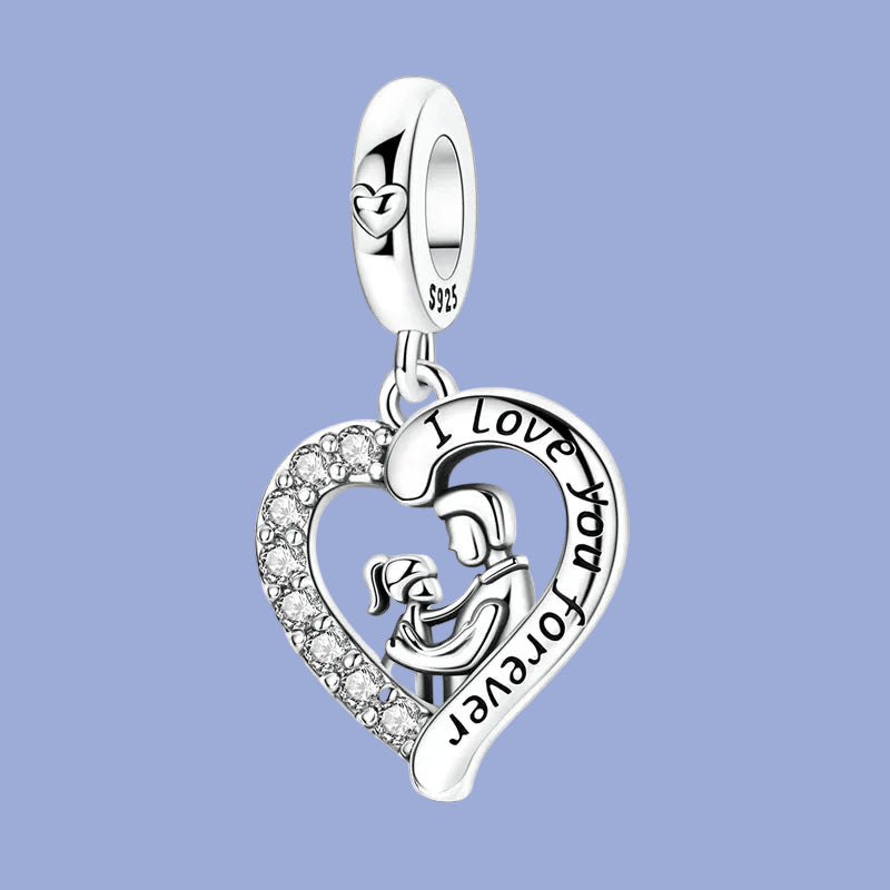Silver heart-shaped pendant with 'I Love You Forever' engraving on a blue background