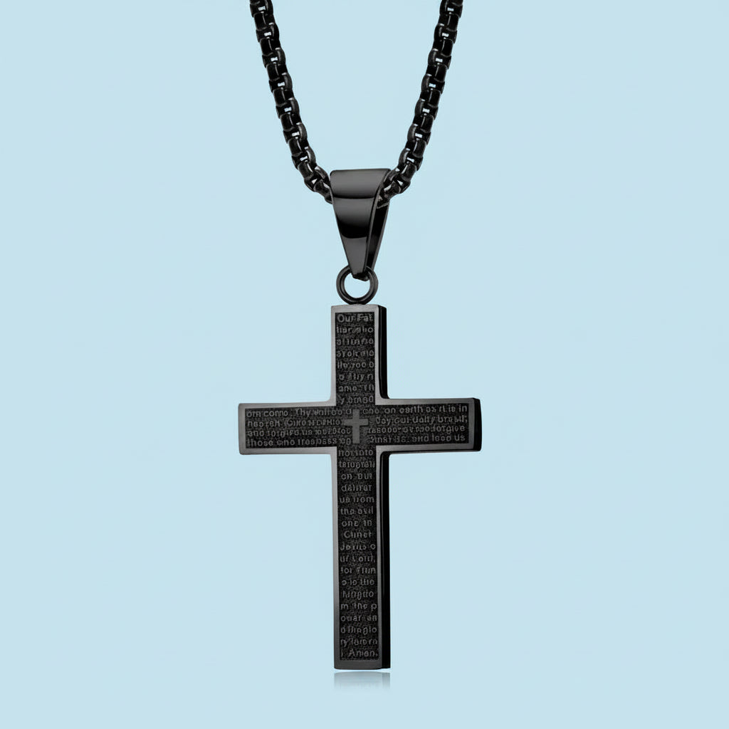 Black cross pendant necklace on a light blue background