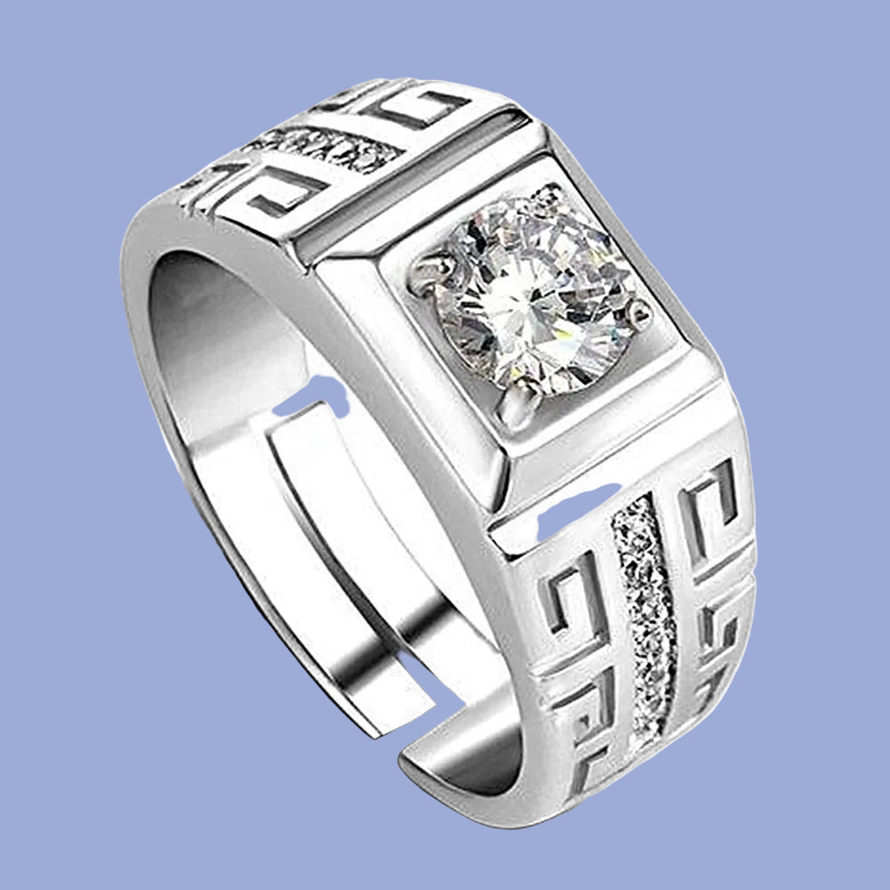 Silver ring with a diamond on a light blue background