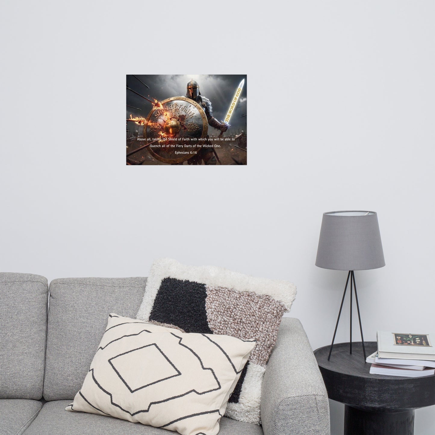 Living room with a gray sofa, decorative pillows, a lamp, with an inspirational poster on the wall.

