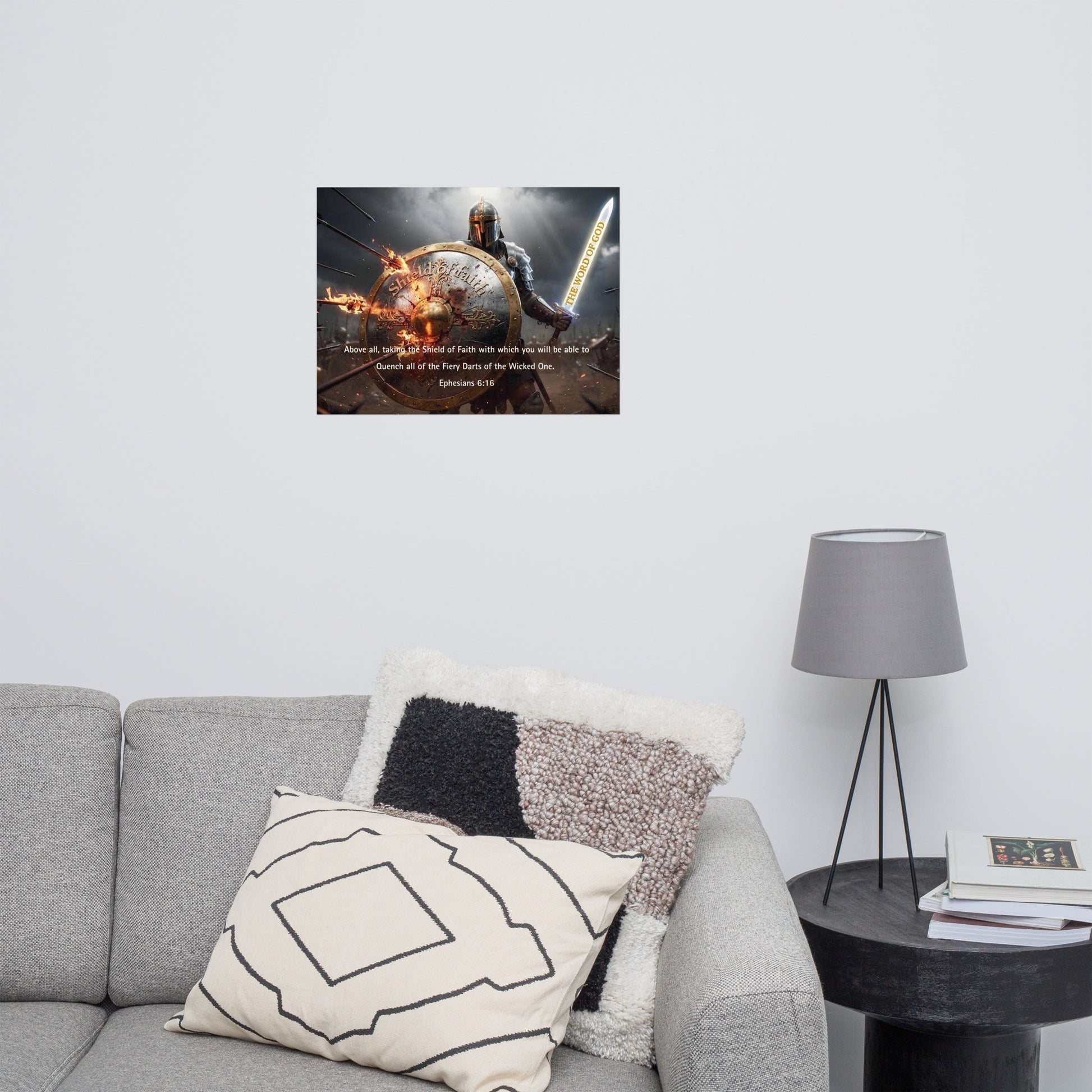 Living room with a gray sofa, decorative pillows, a lamp, with an inspirational poster on the wall.
