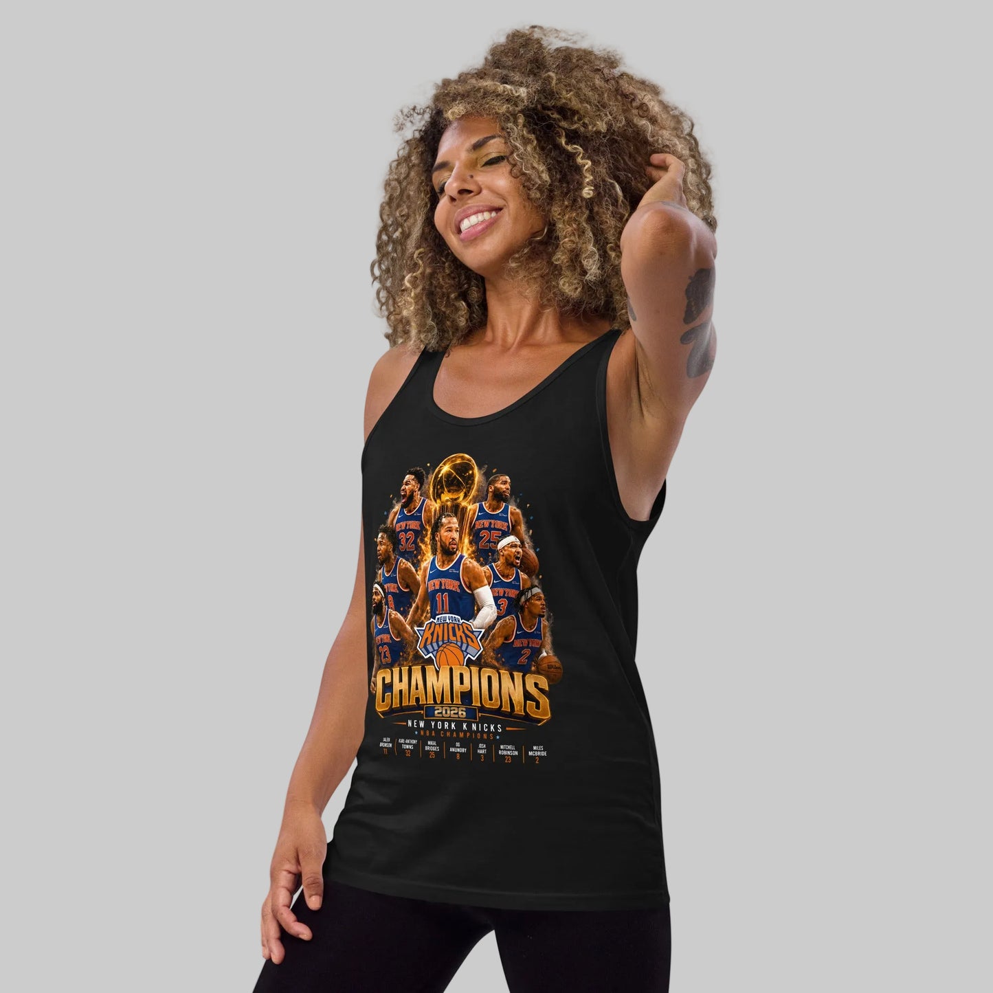 Woman wearing a black tank top with sports team graphics and 'Champions' text on a white background
