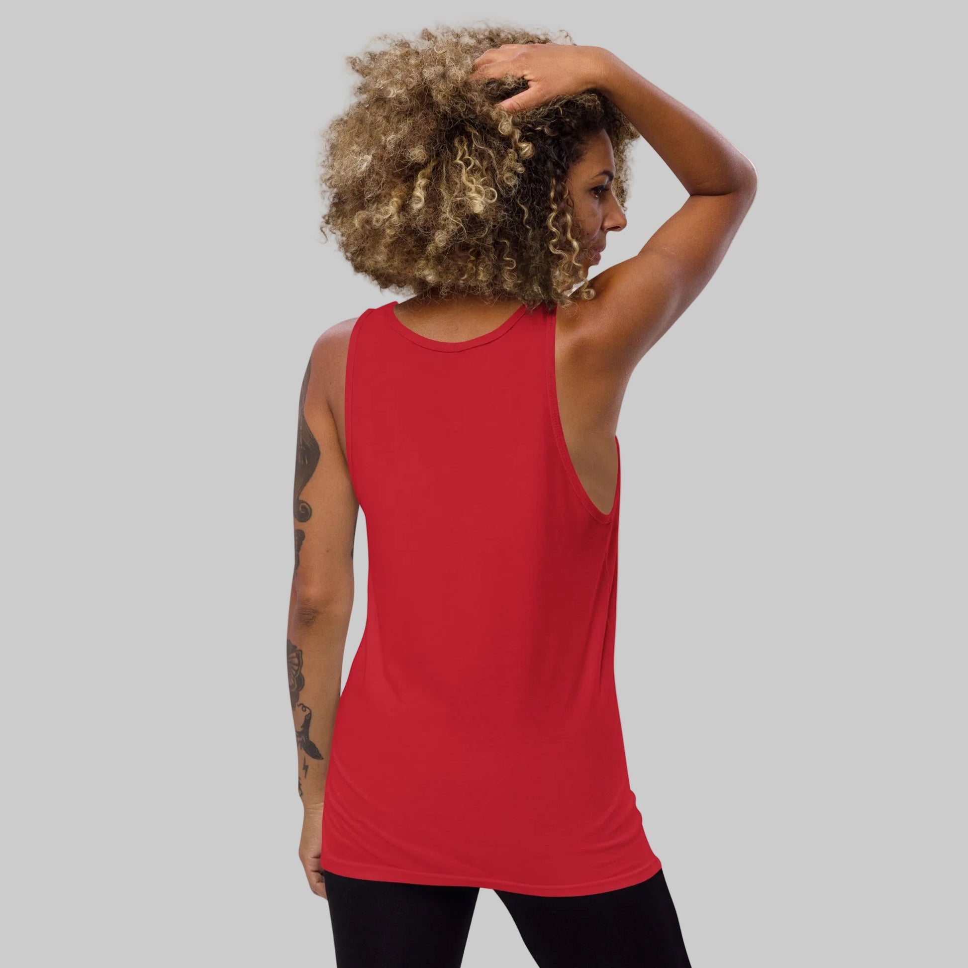 Person wearing a red tank top on a white background