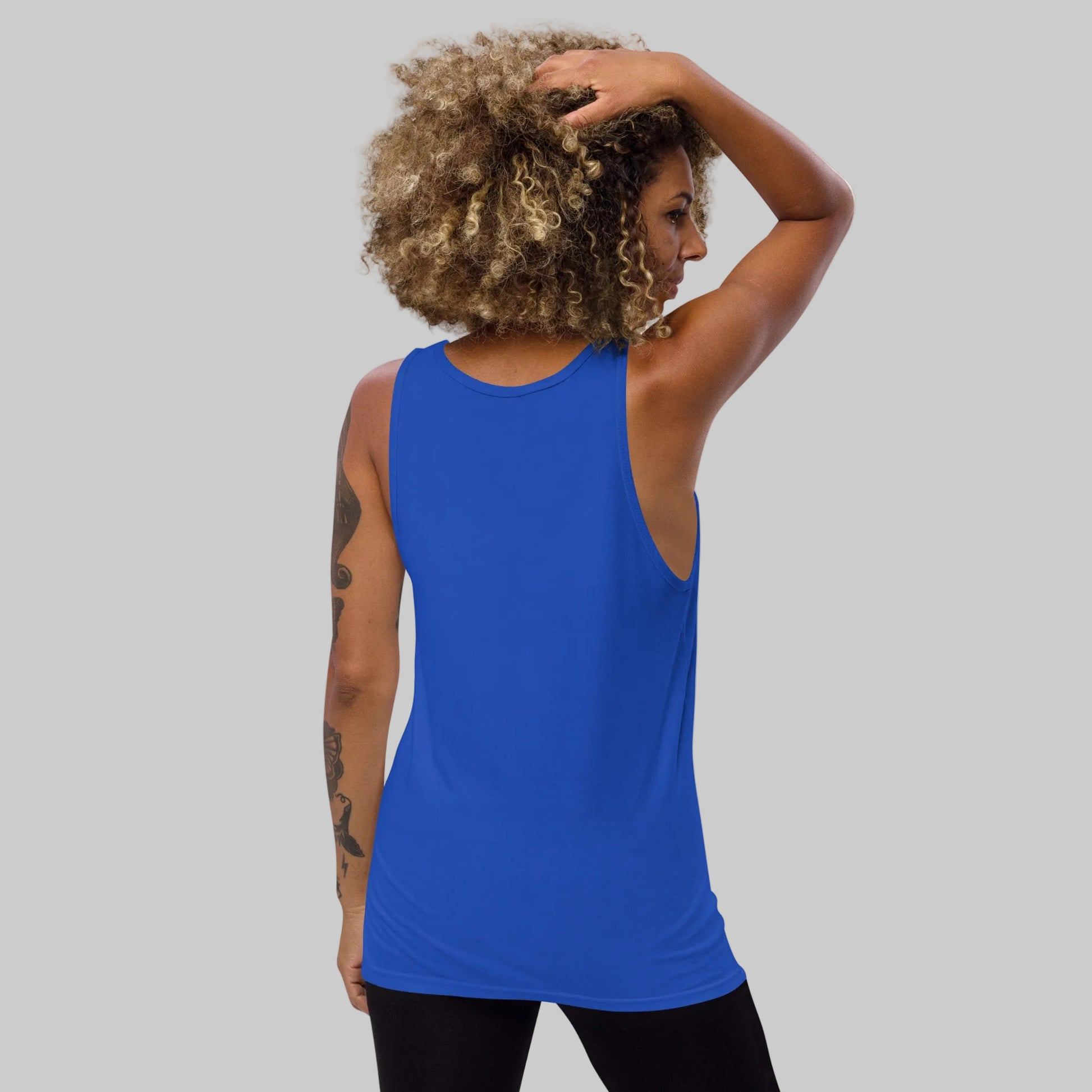 Person wearing a blue tank top on a white background